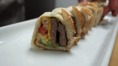A master sushi chef makes a roll out of a Big Mac